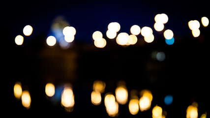 Blurred lights in the city by the River. Photo taken in Poland, Gorzow. - obrazy, fototapety, plakaty