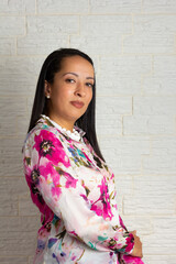 Profile Portrait of Dark tone skin older woman with colorful clothes.