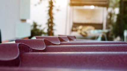 Close up a piece of metal tile roof.