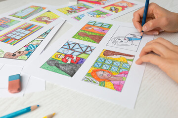 Artist animator draws a color storyboard. Sketches of illustrations for comics or cartoon.