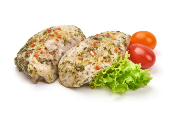 Chicken thighs in garlic sauce with spices, isolated on white background