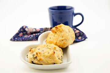 Hot raisin drop biscuits with blue mug and napkin