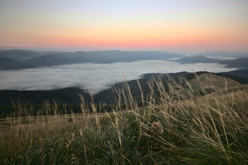 Thick fog covering the valleys in the Bieszczady Mountains