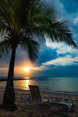 Sunrise at Itaparica Beach on the Brazilian coast, Bahia. Wooded beach with coconut trees and blue sea.