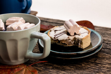 autumn atmosphere tea and coffee with a delicious cake on a wooden background