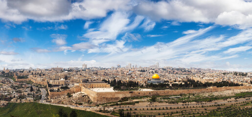 Fototapeta na wymiar Beautiful panoramic aerial view of the Old City, Tomb of the Prophets and Dome of the Rock. Blue Sunny and Cloudy Sky Overlay. Jerusalem, Capital of Israel. Historic Architecture