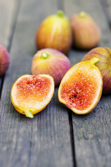 Pink fresh figs on the old wooden table