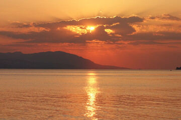 Beautiful sunset over Aegean sea as seen from Santorini island, Cyclades, Greece