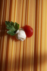 Pasta with a sprig of parsley ketchup and sauce