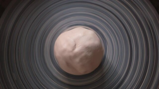 Ceramist Start Working. Put a Piece of White Clay on Pottery Wheel. Young Artist Starts New Pottery Project in Studio. Handmade Creative Art Concept