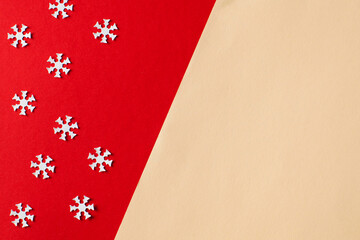 Christmas background, new year red and beige background with white snowflakes. Copy space.