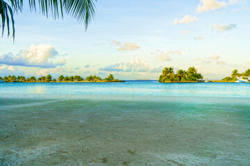 Sandy Beach with Transparent Turquoise Sea or Ocean and Blue Sky