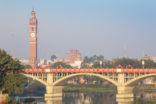 Bridge over Gomti River with Clock Tower in distance, Lucknow, Uttar Pradesh, India