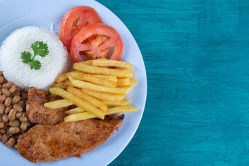 Traditional Brazilian food dish. Blue background. Copy space.