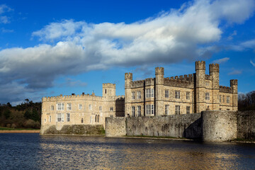 View across the lake to the castle, former home of Catherine of Aragon, first wife of Henry VIII, Leeds Castle, Kent, England, United Kingdom