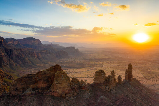 Aerial view by drone of Gheralta Mountains and valley lit by sunset, Hawzen, Tigray Region, Ethiopia