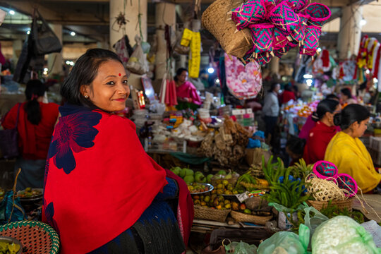 Woman vendor selling colourful dolls, Ima Keithel women's market, Imphal, Manipur, India