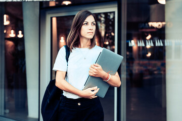 Business woman walking on city street ,modern office building 