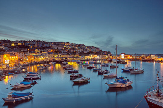 A dusk view of the fishing harbour at Brixham, the south coast's busiest fishing port, in Torbay, on the south coast of Devon, Brixham, Devon, England, United Kingdom