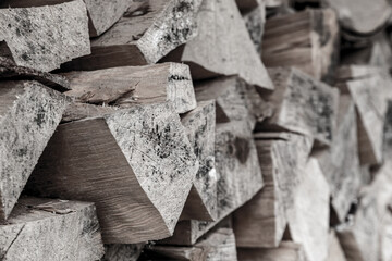 gray wooden background chopped firewood for the fireplace natural fuel pattern, rustic design