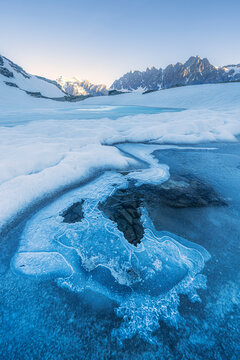 Icy surface of Forbici Lake due to spring thaw, Valmalenco, Valtellina, Sondrio province, Lombardy