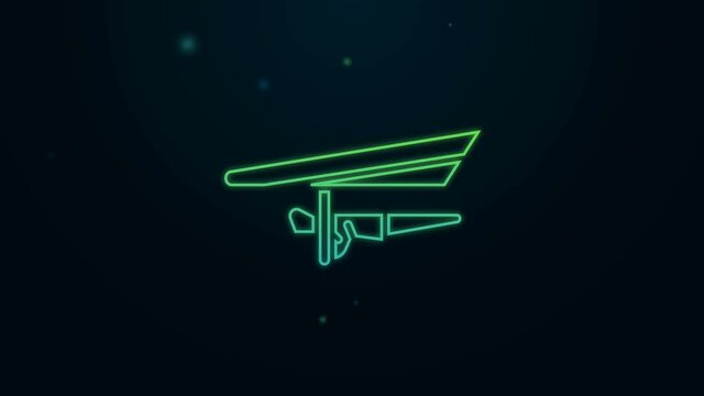 Glowing neon line Hang glider icon isolated on black background. Extreme sport. 4K Video motion graphic animation