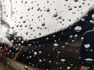 Selected focusing on raindrops and dew on black metal surfaces. These little drops will disappear when exposed to sunlight.