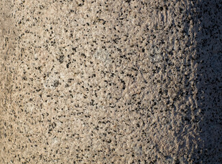 Gray granite wall, stone textured background with shadow