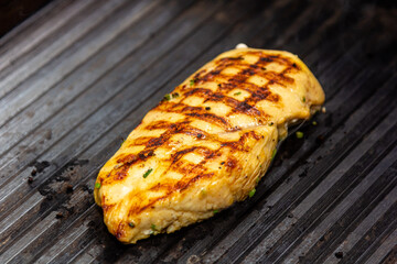 Chicken breast is grilled in a restaurant