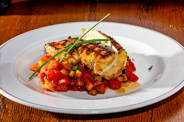 Grilled chicken breast with vegetables on a plate