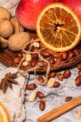 set for cozy autumn. cozy autumn. cup of tea, chocolate cookies, candle, cinnamon, anise, nuts on white knitted sweater. Hygge lifestyle