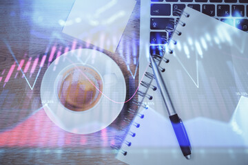 Double exposure of forex chart drawing over table background with computer. Concept of financial research and analysis. Top view.