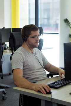 Young Man On Working On His Computer In An Office