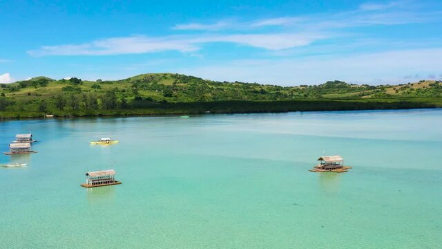 Manlawi Sandbar floating cottages in Caramoan Islands. A floating native cottage on a sandbar in the tourist island of Caramoan in the Philippines