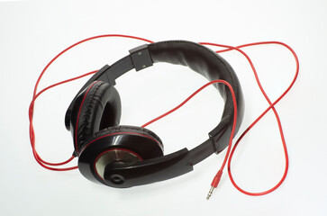 stereo headphones for listening to music and a harmonica	
