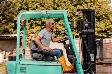 49 years old winemaker working to produce new wine for his winery