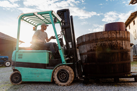 49 years old winemaker working to produce new wine for his winery