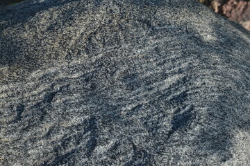 Natural dark gray stone rough texture background