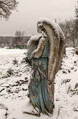 Ukraine. Winter view of St. Mary's sculpture with baby, Jesus Christ, in her hands
