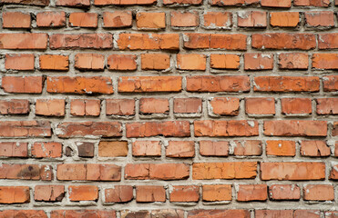 the texture of the old wall from red bricks as background