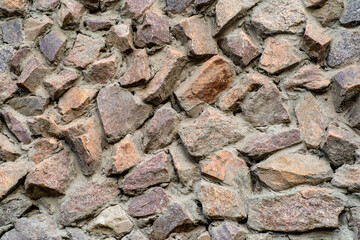 the texture of the old wall from stones as background