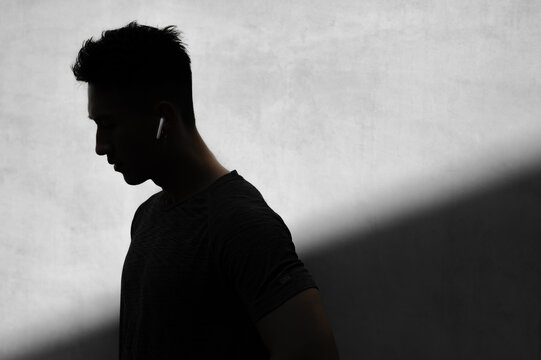 Portrait of silhouette man with earphones