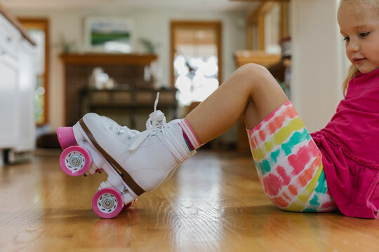 Young Learning to Roller Skate at Home