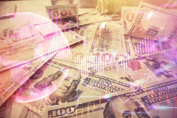 Multi exposure of forex chart drawing over us dollars bill background. Concept of financial success markets.