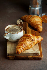 croissants with coffee and jam, tipical cotinental breakfast