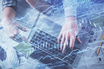 Double exposure of man and woman working together and forex graph hologram drawing. Financial analysis concept. Computer background. Top View.