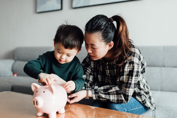 Family saving money in a piggybank