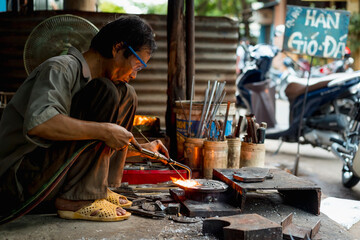 Man working in a mechanical workshop in Vietnam
