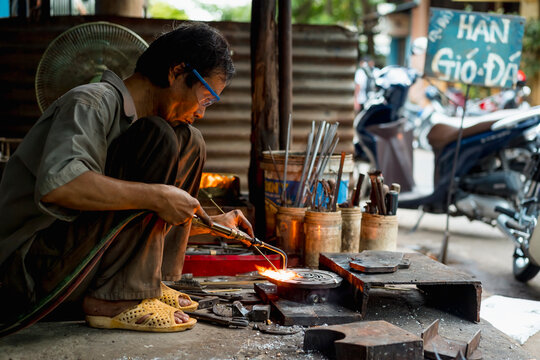 Man working in a mechanical workshop in Vietnam