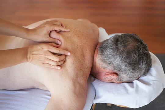 Senior man receiving a massage